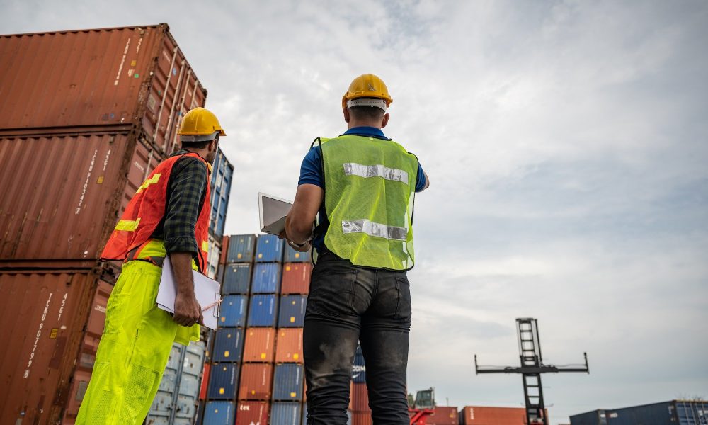 port employee checks containers in the container terminal