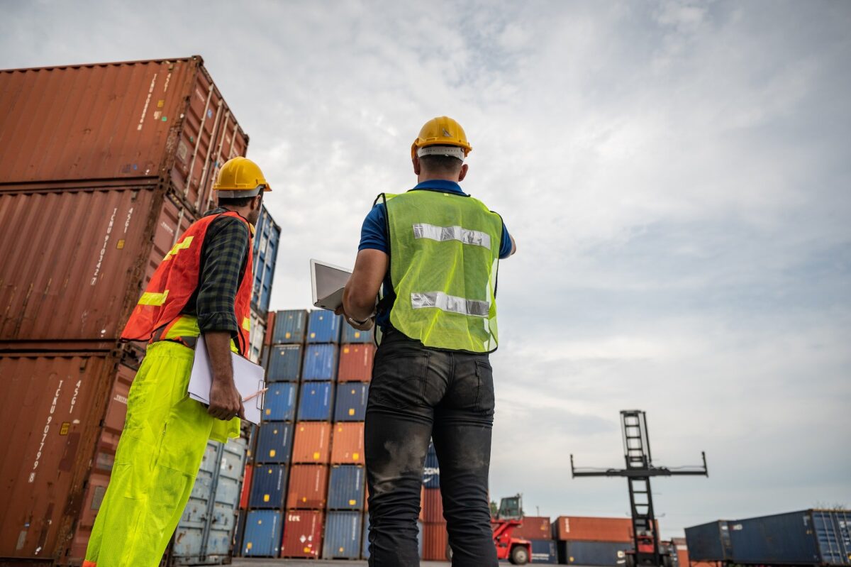 port employee checks containers in the container terminal